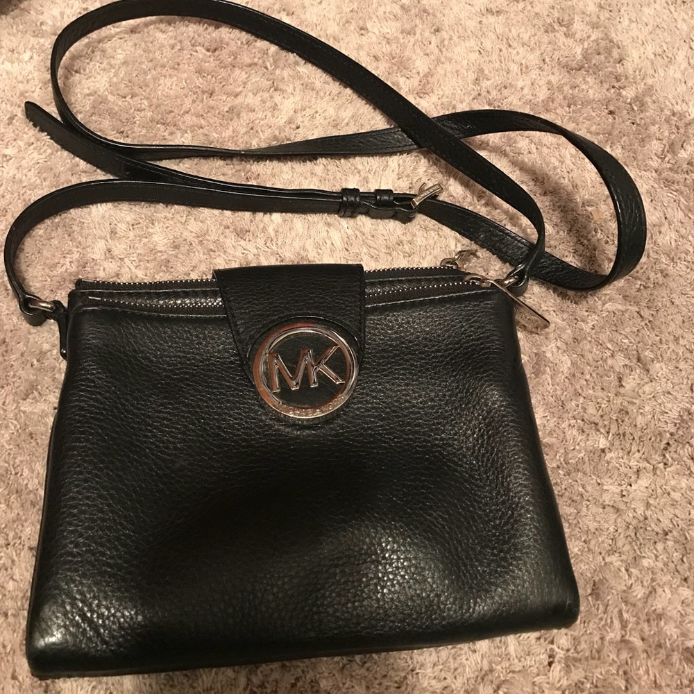 Michael Kors black crossbody leather purse.